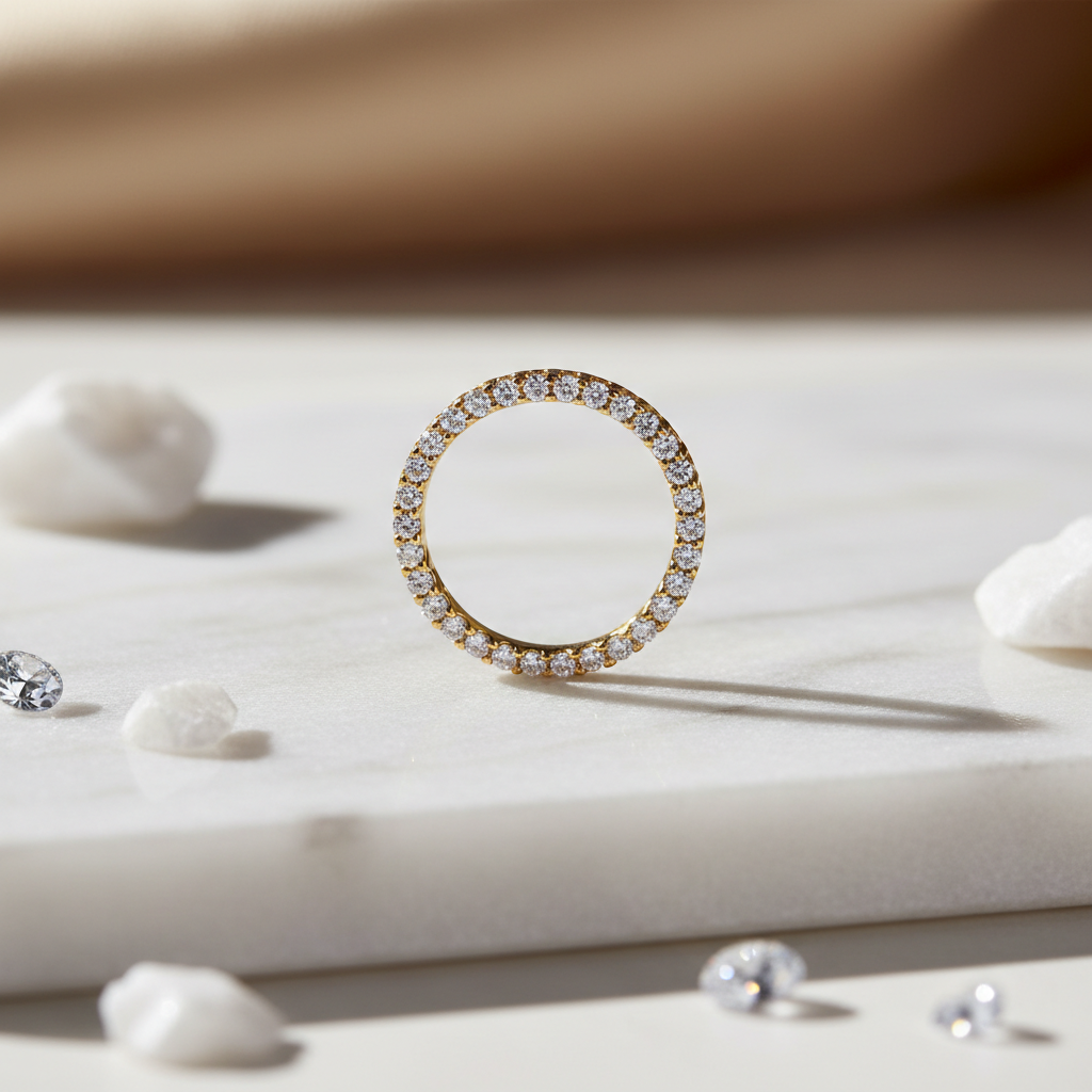 Delicate gold-filled eternity ring with continuous sparkling cubic zirconia stones on white marble
