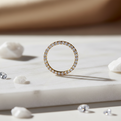 Delicate gold-filled eternity ring with continuous sparkling cubic zirconia stones on white marble